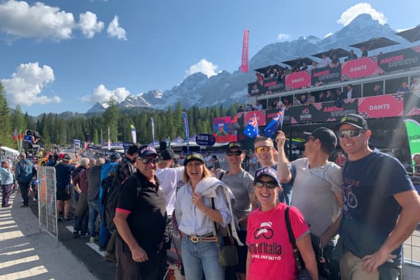 Group of fans at Giro d'Italia, waving Australian flags.