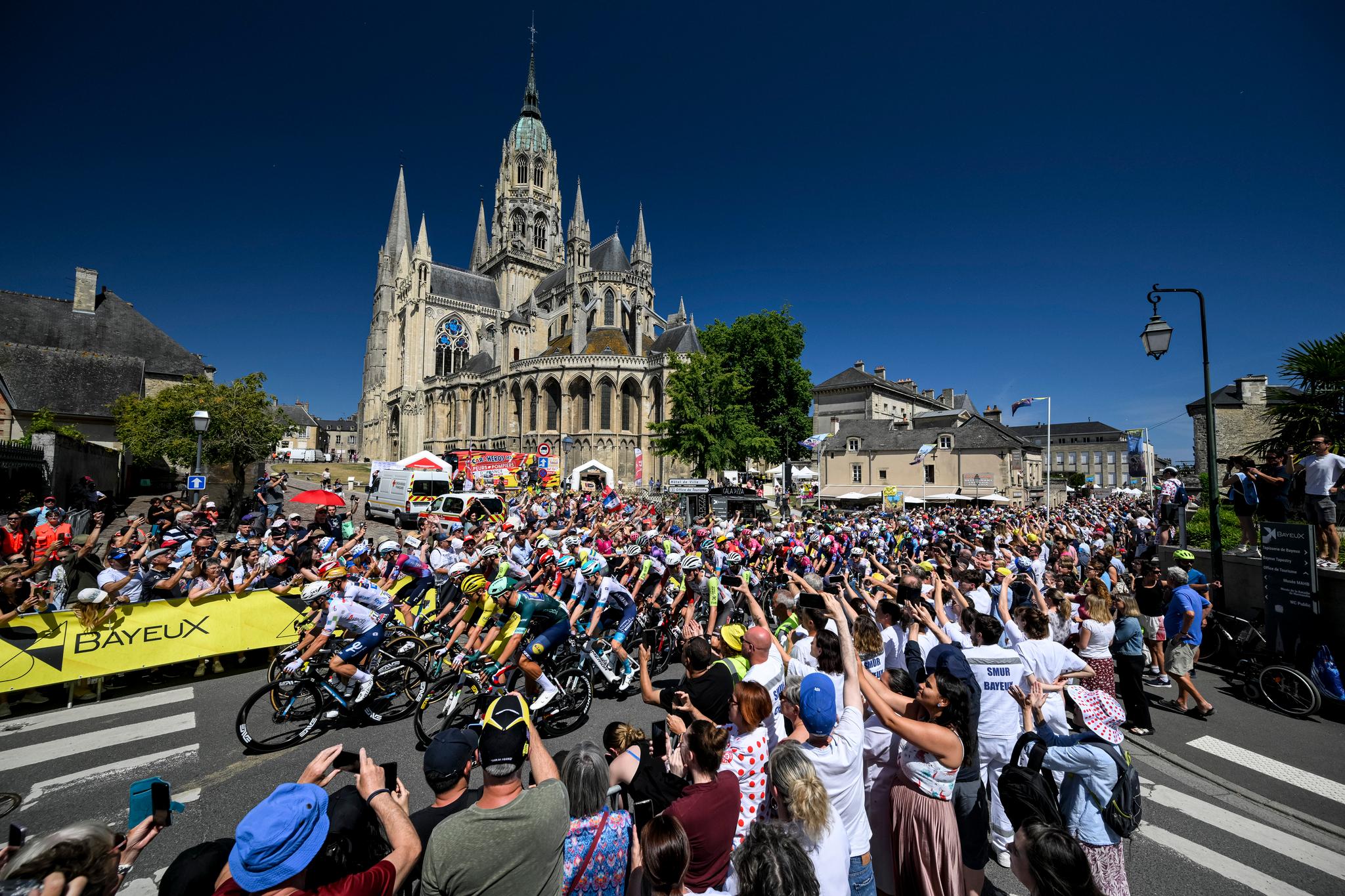 Peloton racing through Bayeux, France, Tour de France 2025
