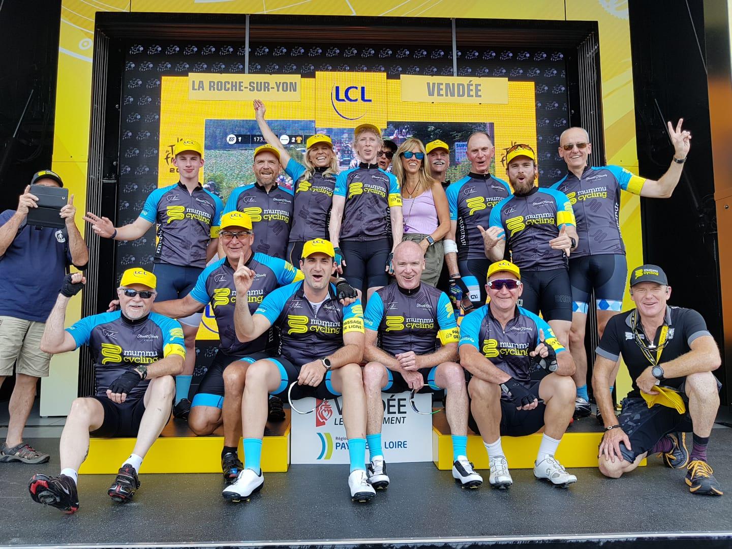 Mummu Cycling group photo on stage in La Roche-sur-Yon, Vendée