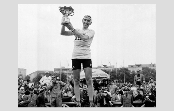 Eddy Merckx celebrates with trophy