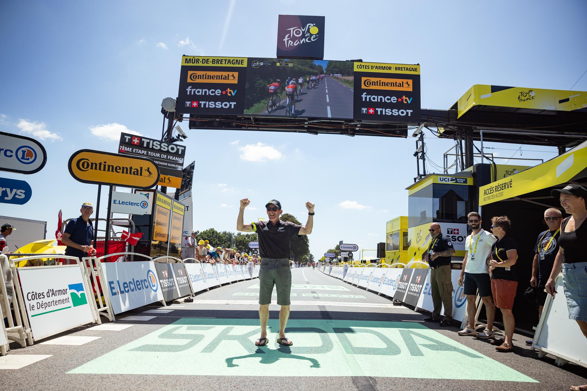 Tour de France finish line celebration at Mûr-de-Bretagne