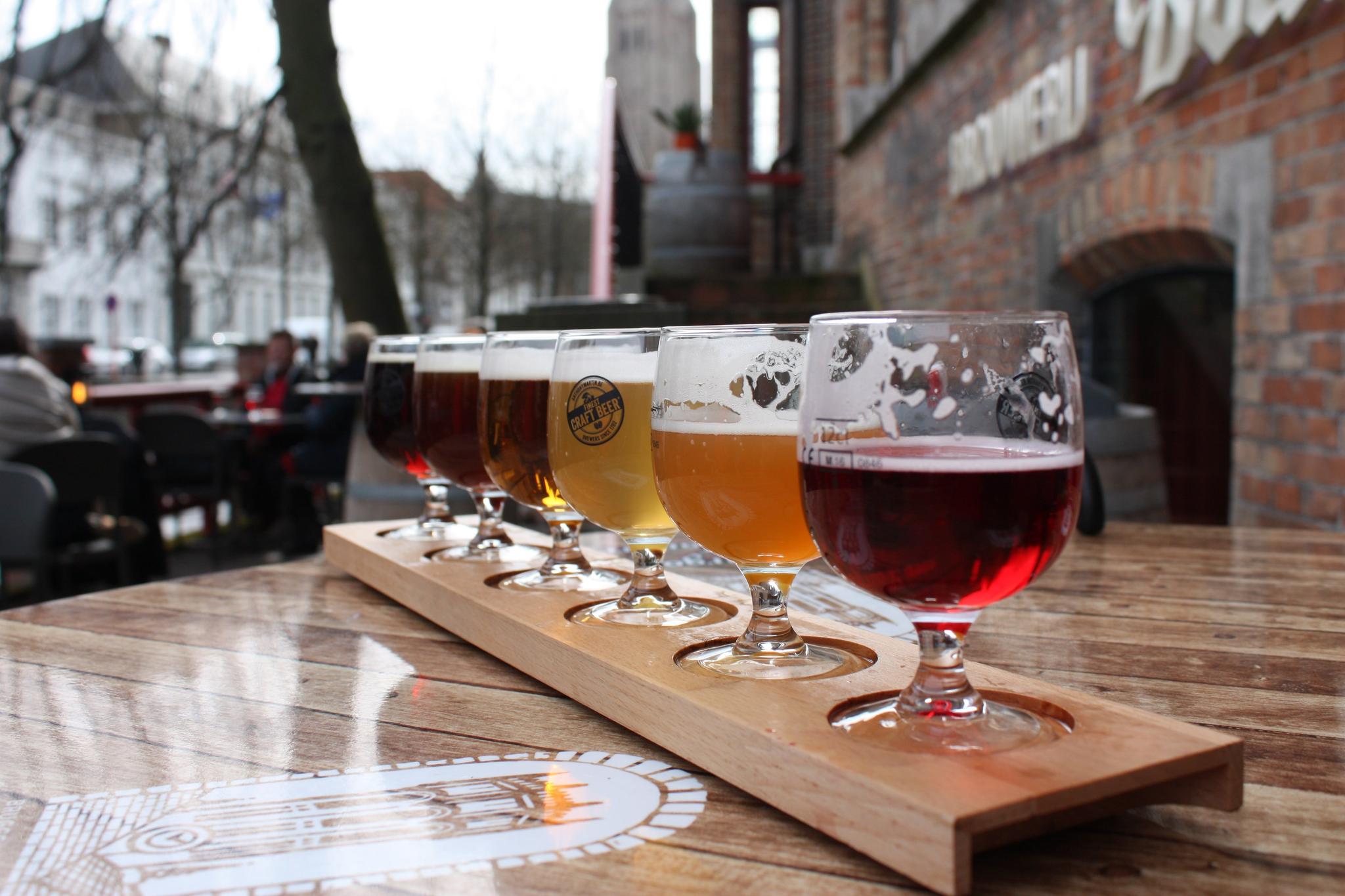 Beer tasting flight with various craft beers.